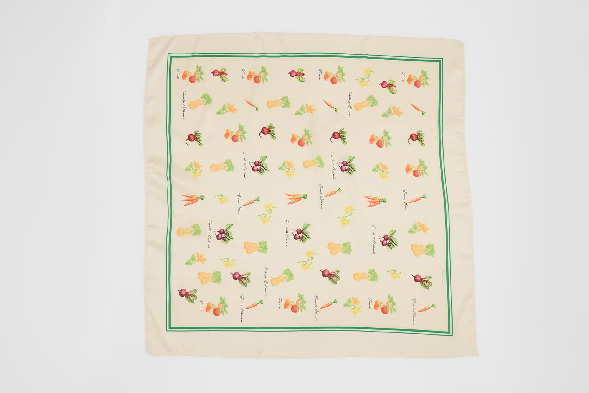 Custom satin cut and sew bandana with a full-color vegetable print and green border, shown flat